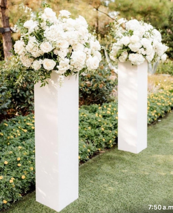 White Columns With Wedding Flowers Arrangement