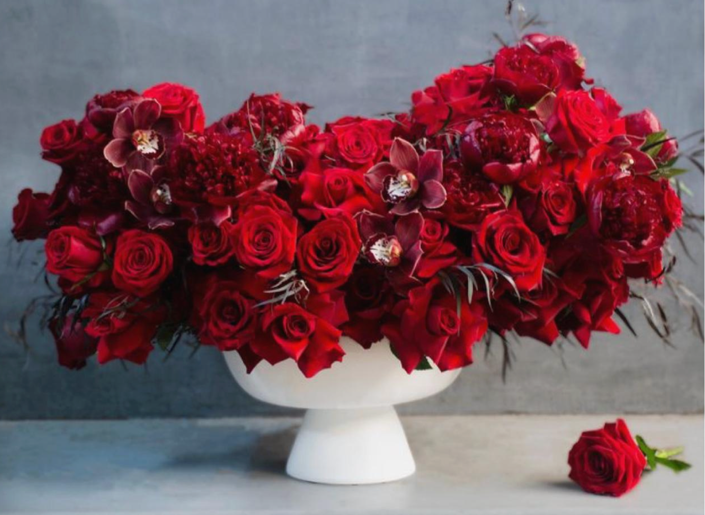 Red Roses And Cymbidium Orchids