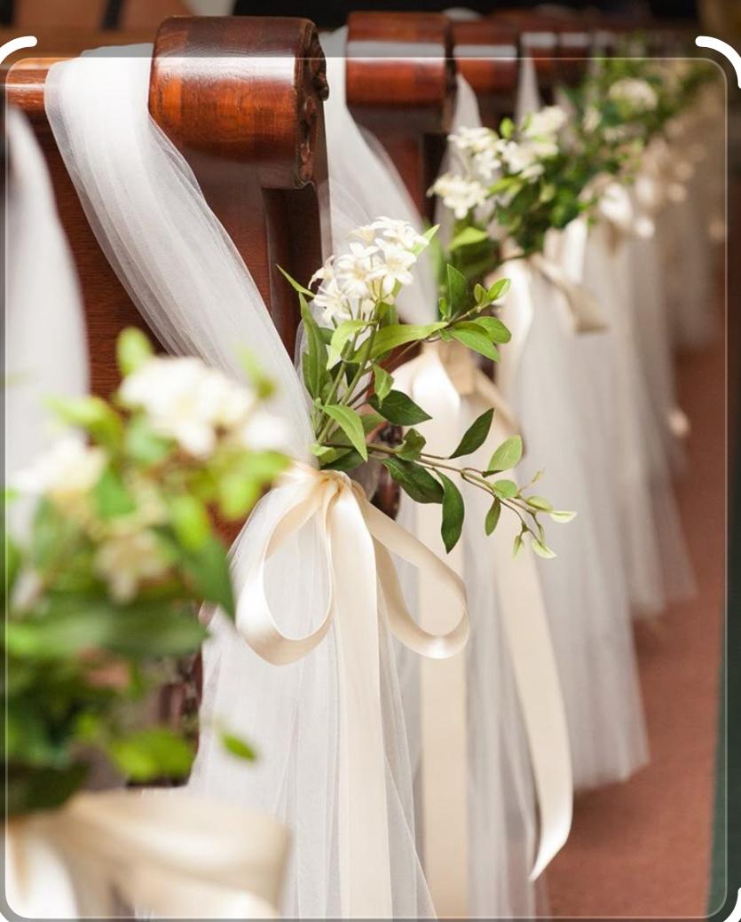 Church Aisle Pews In Tulle Draping And Decorative Ribbons, With A Touch Of Greenery