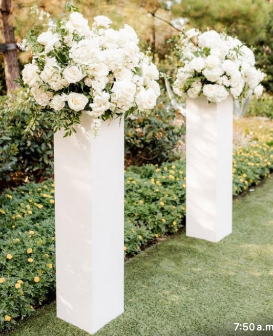 White Columns with wedding flowers arrangement