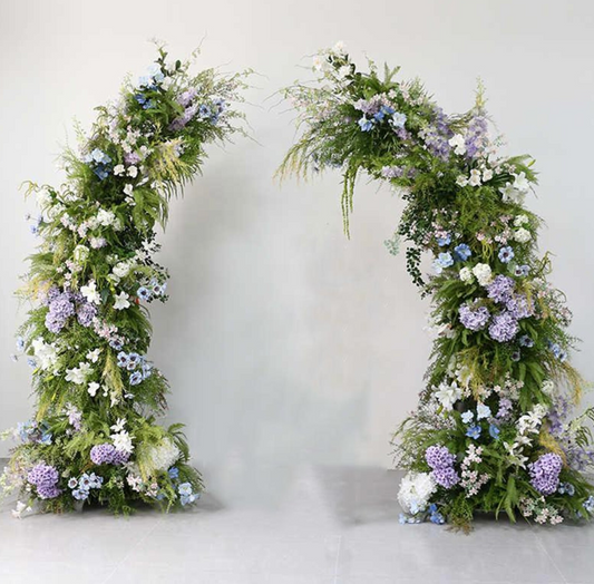Arch with flowers in White, light blue, lilac, & green foliage