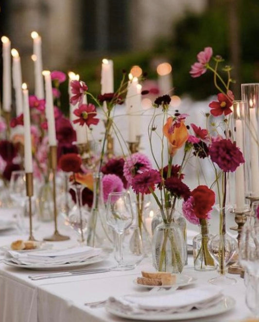 Flowers in 24 bud vases