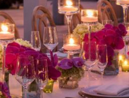 Runner Of Bud And Medium Vases With Pink Orchids Complemented By A Selection Of Seasonal Premium Green And White Blooms,Thoughtfully Based On Your Inspiration, Crafted To Create A Luxuriant Look. (40 Guest)