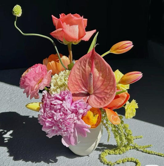 Small arrangements in white matte vase