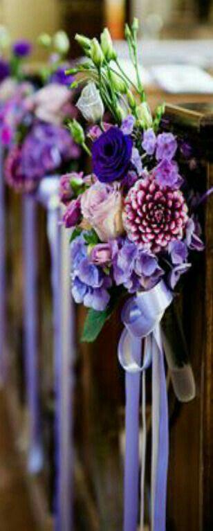 Natural flower details  and decorative ribbons to adorn both sides of the central pews along the main aisle of the church